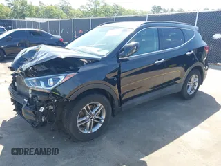 2017 Hyundai Santa Fe 2.4L z VIN 5NMZU3LB4HH024307, wystawiony jako IAAI lot #42147423 z przebiegiem 72 504 mil mil oraz . Historia ofert i sprzedaży dostępna na DreamBid. Obrazek 2.