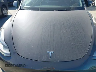 2025 Tesla Model Y Long Range with VIN 7SAYGDED2SF228414, listed as a IAAI auction lot 41706470 with 11,319 mi miles and . Bid and sale history available at DreamBid. Image 10.