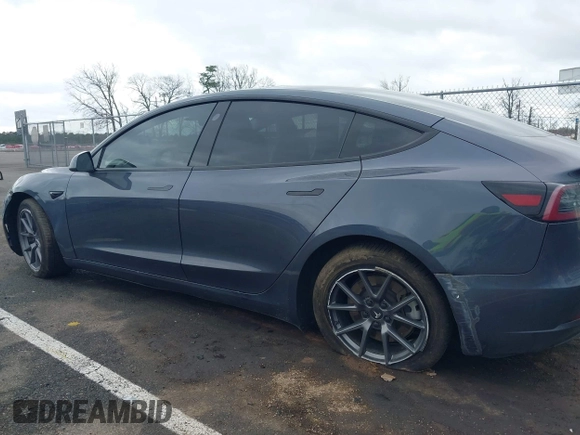 2022 Tesla Model 3 Long Range with VIN 5YJ3E1EB9NF206943, listed as a IAAI auction lot 41911040 with 69,920 mi miles and . Bid and sale history available at DreamBid. Image 6.
