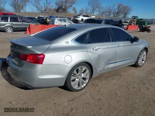 2014 Chevrolet Impala LTZ with VIN 2G1155S32E9282710, listed as a IAAI auction lot 41250424 with 154,486 mi miles. Bid and sale history available at carsss.com. Image 4.