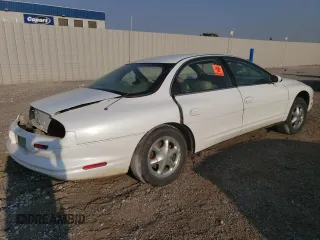1997 Oldsmobile Aurora z VIN 1G3GR62CXV4124968, wystawiony jako Copart lot #69615474 z przebiegiem 249 895 mil mil oraz Nie do naprawy. Historia ofert i sprzedaży dostępna na DreamBid. Obrazek 3.