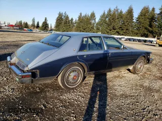 1984 Cadillac Seville z VIN 1G6AS6987EE810927, wystawiony jako Copart lot #42836105 z przebiegiem 19 894 mil mil oraz Tytuł czysty. Historia ofert i sprzedaży dostępna na DreamBid. Obrazek 3.