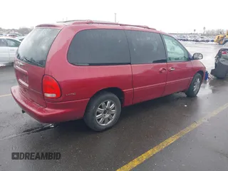 1999 Chrysler Town & Country with VIN 1C4GT64L7XB723937, listed as a IAAI auction lot 41609957 with 242,800 mi miles and . Bid and sale history available at DreamBid. Image 4.
