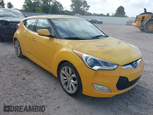 2012 Hyundai Veloster w/Gray Int z VIN KMHTC6AD7CU026855, wystawiony jako IAAI lot #42253694 z przebiegiem 119 802 mil mil oraz . Historia ofert i sprzedaży dostępna na DreamBid. Obrazek 1.