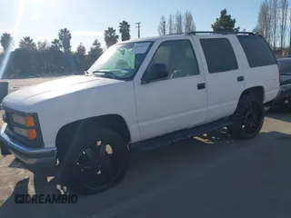 1997 GMC Yukon with VIN 1GKEK13R9VJ741768, listed as a IAAI auction lot 41692027 with 200,681 mi miles. Bid and sale history available at carsss.com. Image 2.