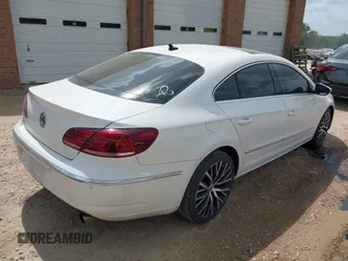 2014 Volkswagen CC Executive z VIN WVWGU7ANXEE507486, wystawiony jako IAAI lot #41943516 z przebiegiem 148 796 mil mil oraz . Historia ofert i sprzedaży dostępna na DreamBid. Obrazek 4.