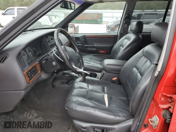 1998 Jeep Grand Cherokee Limited z VIN 1J4GZ78S0WC276411, wystawiony jako Copart lot #78200114 z przebiegiem 220 856 mil mil oraz Szkoda całkowita • Salvage title. Historia ofert i sprzedaży dostępna na DreamBid. Obrazek 7.