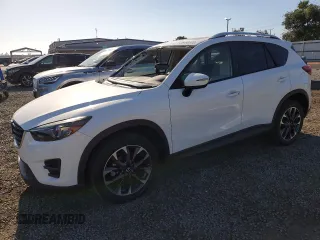 2016 Mazda CX-5 Grand Touring z VIN JM3KE4DY1G0861609, wystawiony jako Copart lot #56158185 z przebiegiem 81 924 mil mil oraz Szkoda całkowita • Salvage title. Historia ofert i sprzedaży dostępna na DreamBid. Obrazek 1.