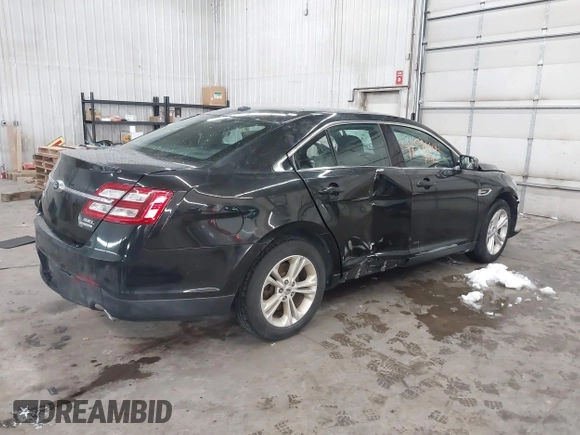 2015 Ford Taurus SEL with VIN 1FAHP2E81FG181897, listed as a IAAI auction lot 41598004 with Not Provided miles and . Bid and sale history available at carsss.com. Image 4.