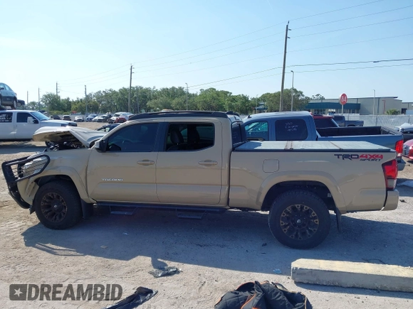 2018 Toyota Tacoma SR5 z VIN 3TMDZ5BN4JM039802, wystawiony jako IAAI lot #42300924 z przebiegiem 48 828 mil mil oraz . Historia ofert i sprzedaży dostępna na DreamBid. Obrazek 14.