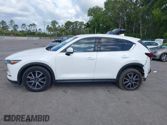 2018 Mazda CX-5 Grand Touring with VIN JM3KFBDM6J0451605, listed as a IAAI auction lot 42099182 with 81,703 mi miles and . Bid and sale history available at DreamBid. Image 14.