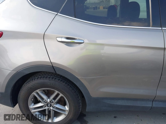 2018 Hyundai Santa Fe 2.4L with VIN 5NMZT3LB4JH069868, listed as a IAAI auction lot 42675555 with 142,612 mi miles and . Bid and sale history available at DreamBid. Image 6.