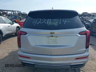2020 Cadillac XT6 FWD Premium Luxury z VIN 1GYKPCRSXLZ136057, wystawiony jako IAAI lot #42211514 z przebiegiem 32 476 mil mil oraz . Historia ofert i sprzedaży dostępna na DreamBid. Obrazek 16.