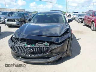2021 Mazda CX-30 Select z VIN 3MVDMABL1MM251761, wystawiony jako IAAI lot #42267217 z przebiegiem 42 617 mil mil oraz . Historia ofert i sprzedaży dostępna na DreamBid. Obrazek 6.