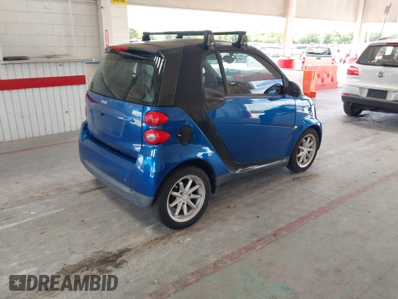 2008 Smart fortwo Pure with VIN WMEEJ31X28K123879, listed as a IAAI auction lot 42258663 with 93,056 mi miles and . Bid and sale history available at DreamBid. Image 4.