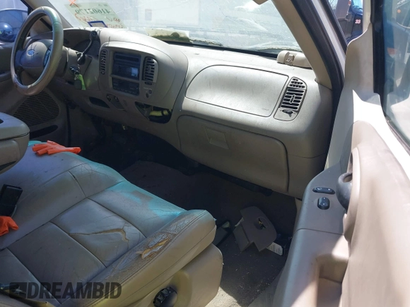 2003 Ford F-150 XL with VIN 1FTRX17L03NA16778, listed as a IAAI auction lot 41602179 with 219,101 mi miles. Bid and sale history available at carsss.com. Image 5.