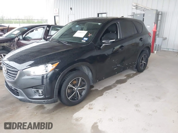 2016 Mazda CX-5 Touring with VIN JM3KE2CY2G0808424, listed as a IAAI auction lot 41880494 with 149,005 mi miles. Bid and sale history available at carsss.com. Image 6.