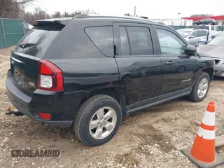 2016 Jeep Compass Latitude with VIN 1C4NJCEBXGD642680, listed as a IAAI auction lot 41511653 with 122,742 mi miles. Bid and sale history available at carsss.com. Image 4.