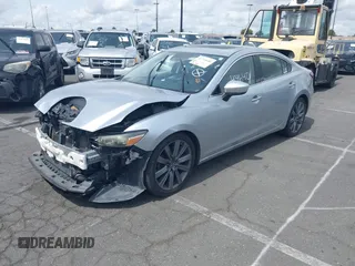 2018 Mazda 6 Grand Touring with VIN JM1GL1TY0J1306768, listed as a IAAI auction lot 41744640 with 81,798 mi miles and . Bid and sale history available at DreamBid. Image 2.