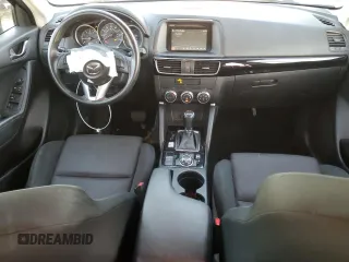 2016 Mazda CX-5 Sport with VIN JM3KE2BY9G0771969, listed as a Copart auction lot 80966064 with 99,348 mi miles and Salvage title. Bid and sale history available at DreamBid. Image 8.