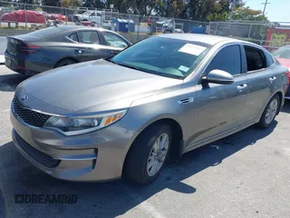 2016 Kia Optima LX with VIN 5XXGT4L33GG106342, listed as a IAAI auction lot 42272945 with 94,645 mi miles and . Bid and sale history available at DreamBid. Image 2.