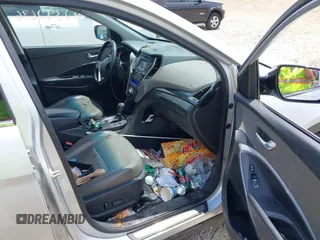 2013 Hyundai Santa Fe Sport z VIN 5XYZUDLA8DG055576, wystawiony jako IAAI lot #42392636 z przebiegiem 165 096 mil mil oraz . Historia ofert i sprzedaży dostępna na DreamBid. Obrazek 5.
