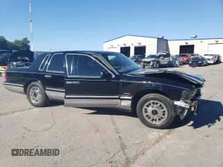 1997 Lincoln Town Car Signature z VIN 1LNLM82W0VY755395, wystawiony jako Copart lot #60832324 z przebiegiem 143 323 mil mil oraz Szkody całkowita. Historia ofert i sprzedaży dostępna na DreamBid. Obrazek 4.