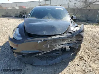 2021 Tesla Model 3 Standard Range Plus with VIN 5YJ3E1EA6MF067702, listed as a Copart auction lot 52048315 with 72,974 mi miles and Salvage Title. Bid and sale history available at carsss.com. Image 5.