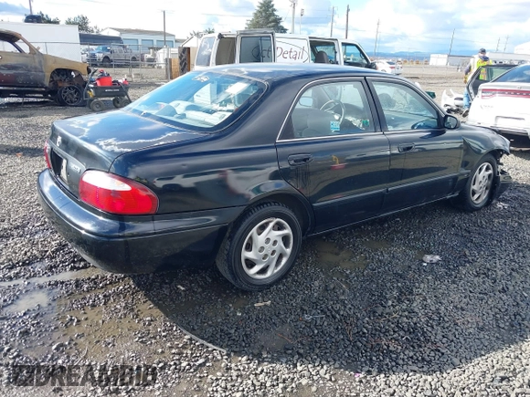 2000 Mazda 626 LX z VIN 1YVGF22CXY5123930, wystawiony jako IAAI lot #40712369 z przebiegiem 210 234 mil mil oraz . Historia ofert i sprzedaży dostępna na DreamBid. Obrazek 4.