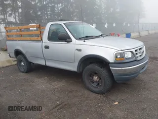 1999 Ford F-150 with VIN 2FTZF1828XCA85643, listed as a IAAI auction lot 41347113 with 173,813 mi miles and . Bid and sale history available at DreamBid. Image 1.