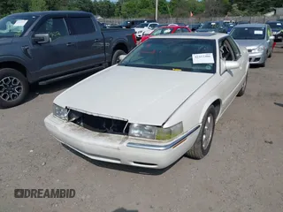 2000 Cadillac Eldorado Touring ETC z VIN 1G6ET129XYU162451, wystawiony jako IAAI lot #42412406 z przebiegiem 89 413 mil mil oraz . Historia ofert i sprzedaży dostępna na DreamBid. Obrazek 6.