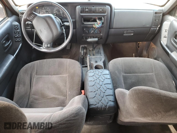 1999 Jeep Cherokee Sport with VIN 1J4FF68S6XL574980, listed as a Copart auction lot 51639635 with 257,854 mi miles and Salvage Title. Bid and sale history available at carsss.com. Image 8.