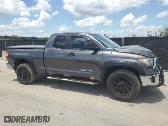 2019 Toyota Tundra SR with VIN 5TFRM5F13KX141745, listed as a Copart auction lot 56910955 with 67,856 mi miles and Salvage title. Bid and sale history available at DreamBid. Image 4.