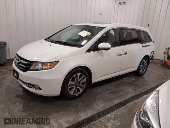 2015 Honda Odyssey Touring Elite with VIN 5FNRL5H92FB020159, listed as a IAAI auction lot 42103240 with 79,322 mi miles and . Bid and sale history available at DreamBid. Image 2.