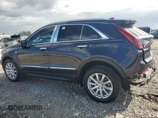 2023 Cadillac XT4 FWD Luxury with VIN 1GYAZAR4XPF104311, listed as a Copart auction lot 46891635 with 28,972 mi miles and Non repairable. Bid and sale history available at DreamBid. Image 2.
