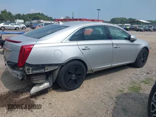 2014 Cadillac XTS Luxury z VIN 2G61N5S38E9270619, wystawiony jako IAAI lot #40140617 z przebiegiem 117 286 mil mil oraz . Historia ofert i sprzedaży dostępna na DreamBid. Obrazek 4.