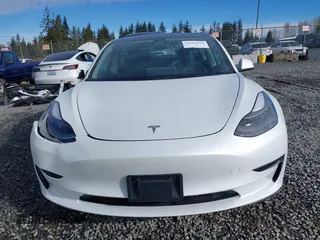 2021 Tesla Model 3 Standard Range Plus z VIN 5YJ3E1EAXMF871730, wystawiony jako IAAI lot #41794274 z przebiegiem 18 791 mil mil oraz . Historia ofert i sprzedaży dostępna na DreamBid. Obrazek 12.