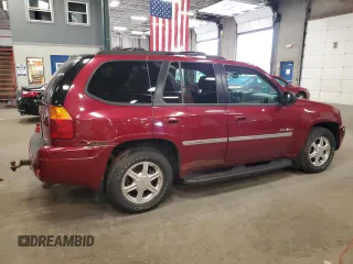 2006 GMC Envoy SLE z VIN 1GKDT13S062263876, wystawiony jako Copart lot #60245185 z przebiegiem 156 567 mil mil oraz Czysty tytuł • Clean title. Historia ofert i sprzedaży dostępna na DreamBid. Obrazek 3.