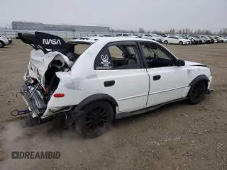 2002 Hyundai Accent GL with VIN KMHCG45C92U271388, listed as a Copart auction lot 85925124 with 98,390 mi miles and Salvage Title. Bid and sale history available at carsss.com. Image 3.