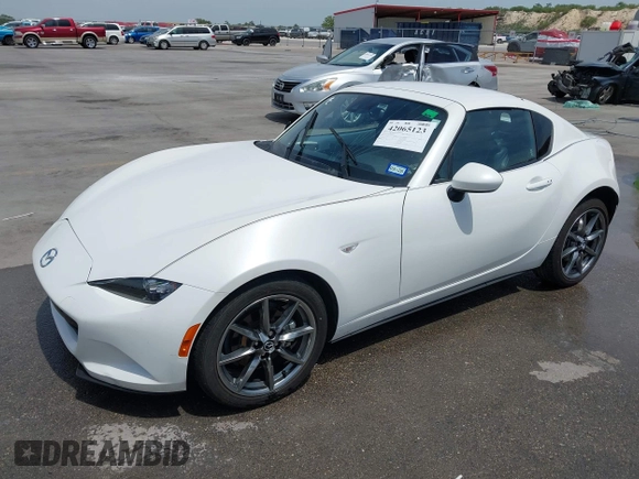 2023 Mazda MX-5 Miata Grand Touring с VIN JM1NDAM71P0560062, выставлен на аукционе IAAI как лот 42065123 с пробегом 11 320 миль миль и . История ставок и продаж доступна на DreamBid. Изображение 2.