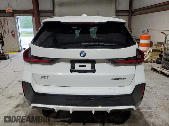2023 BMW X1 xDrive28i with VIN WBX73EF08P5X60980, listed as a Copart auction lot 59899385 with 21,975 mi miles and Salvage title. Bid and sale history available at DreamBid. Image 6.