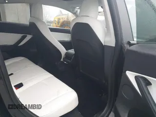 2021 Tesla Model Y Standard Range with VIN 5YJYGDED9MF103989, listed as a IAAI auction lot 41482268 with 33,485 mi miles and . Bid and sale history available at DreamBid. Image 8.