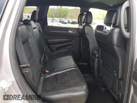 2018 Jeep Grand Cherokee Laredo E with VIN 1C4RJFAG0JC173200, listed as a Copart auction lot 55326805 with 127,489 mi miles and Salvage Title. Bid and sale history available at DreamBid. Image 11.