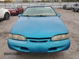 1994 Ford Thunderbird LX with VIN 1FALP6243RH223519, listed as a Copart auction lot 80962814 with 125,016 mi miles and Salvage Title. Bid and sale history available at DreamBid. Image 5.