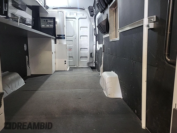 2023 Ford Transit Cargo with VIN 1FTBW3U84PKB20116, listed as a IAAI auction lot 42748031 with 6,591 mi miles and . Bid and sale history available at DreamBid. Image 15.