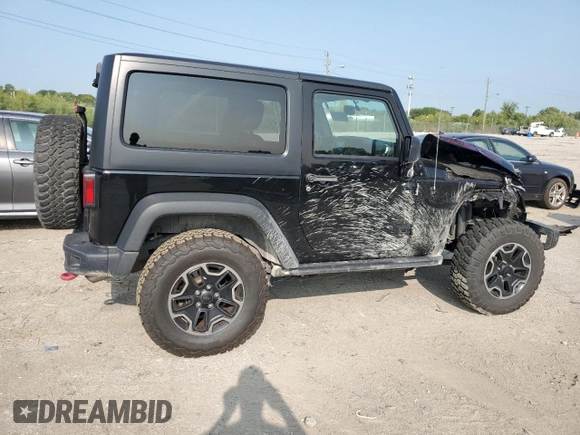 2015 Jeep Wrangler Rubicon Hard Rock z VIN 1C4BJWCG9FL714606, wystawiony jako Copart lot #68521014 z przebiegiem 35 187 mil mil oraz Szkoda całkowita • Salvage title. Historia ofert i sprzedaży dostępna na DreamBid. Obrazek 3.