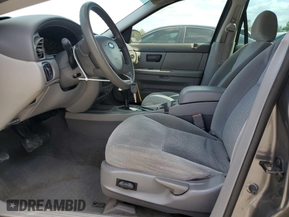 2004 Ford Taurus SE with VIN 1FAFP53U24A137741, listed as a Copart auction lot 54313915 with 92,739 mi miles and Salvage Title. Bid and sale history available at DreamBid. Image 7.