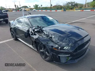 2021 Ford Mustang GT z VIN 1FA6P8CF1M5147740, wystawiony jako IAAI lot #38920487 z przebiegiem 15 299 mil mil oraz . Historia ofert i sprzedaży dostępna na DreamBid. Obrazek 18.