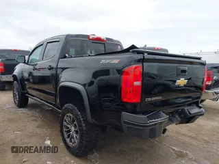2018 Chevrolet Colorado 4WD ZR2 with VIN 1GCGTEEN9J1173647, listed as a IAAI auction lot 42016015 with 102,041 mi miles. Bid and sale history available at carsss.com. Image 3.