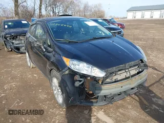 2014 Ford Fiesta Titanium z VIN 3FADP4FJXEM127644, wystawiony jako IAAI lot #41555040 z przebiegiem 107 046 mil mil oraz . Historia ofert i sprzedaży dostępna na DreamBid. Obrazek 1.